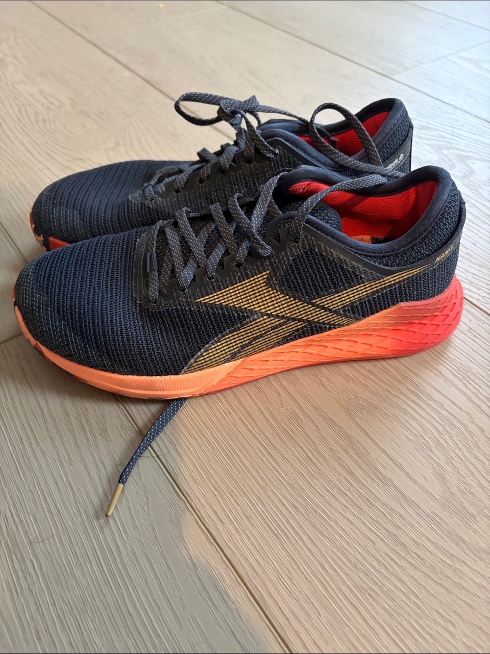 Reebok Black Knit Sneakers with Gold Accent and Red Lining